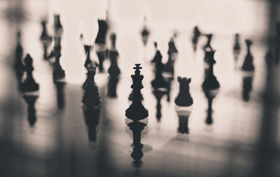 Close-up of chess pieces on table