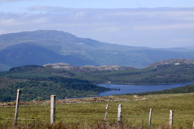 Scenic view of lake with mountains in background