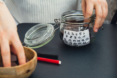 Cropped hand of man preparing food
