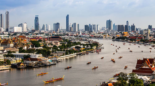 High angle view of river amidst buildings in city
