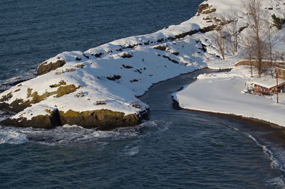 High angle view of frozen sea shore