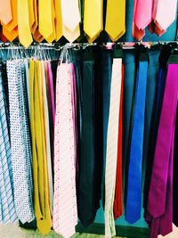 Neckties hanging on rack in clothing store