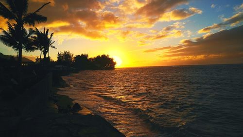 Scenic view of sea against sky at sunset