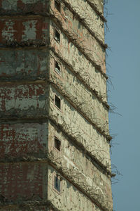 Low angle view of building against clear blue sky