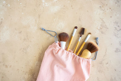 High angle view of paintbrushes on beach