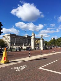 View of city street against blue sky