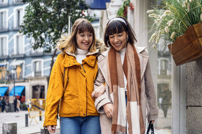 Portrait of a smiling young woman standing outdoors