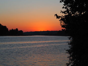 Scenic view of sea against orange sky