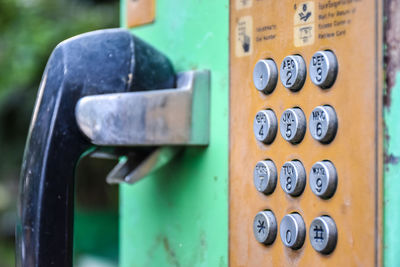 Close-up of buttons on telephone booth