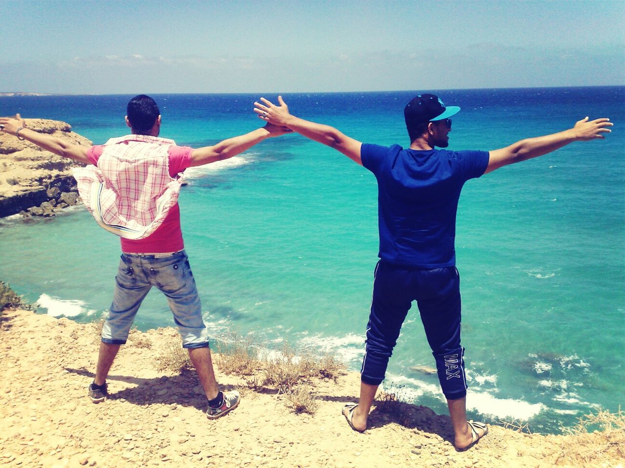 sea, water, beach, rear view, casual clothing, lifestyles, full length, shore, leisure activity, blue, horizon over water, standing, childhood, boys, sand, sky, vacations, nature