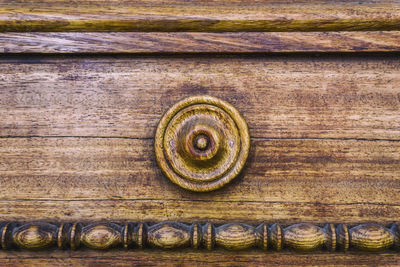 Close-up of carvings on wooden door