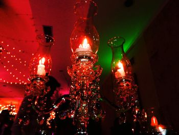 Low angle view of illuminated christmas lights hanging on ceiling