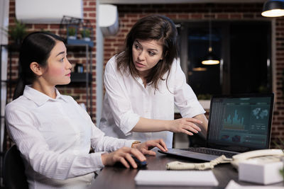 Business colleagues having discussion at office