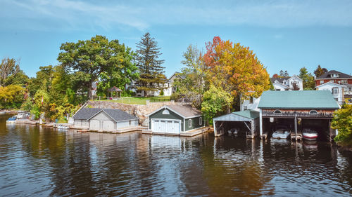 Boat cottage dock. lake ontario in autumn. colorful vivid trees. canada, united states of america.