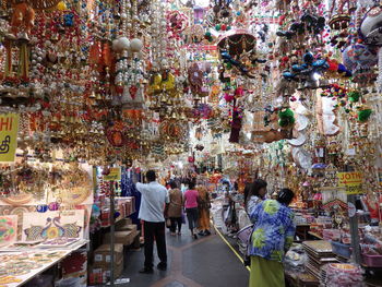 People at market stall in city