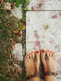 Low section of woman on footpath