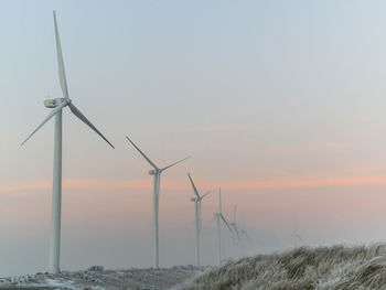 Wind turbines on field