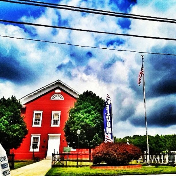 building exterior, architecture, sky, built structure, cloud - sky, cloud, tree, cloudy, house, residential structure, low angle view, blue, residential building, day, no people, growth, outdoors, green color, power line, grass