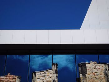 Low angle view of building against blue sky