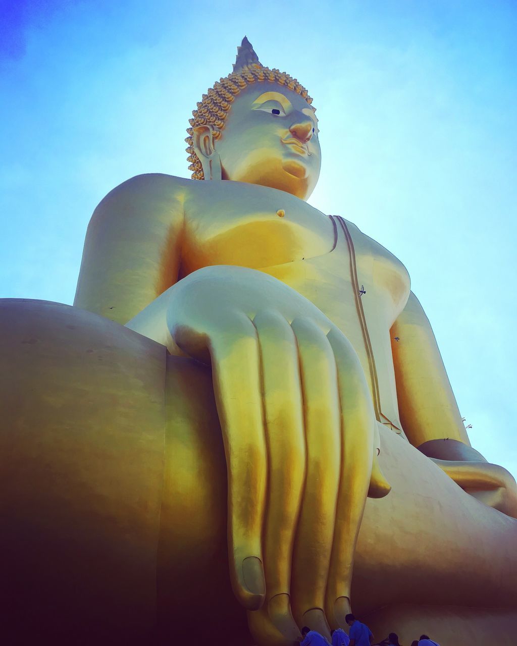 CLOSE-UP OF STATUE AGAINST SKY