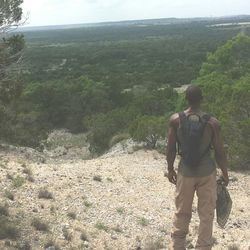 Rear view of man standing on landscape