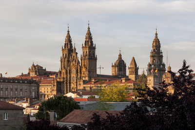 Panoramic view of buildings in city against sky