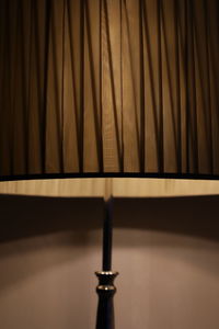 Close-up of electric lamp on table