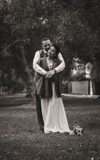 Portrait of young couple standing in park