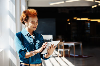 Young woman using smart phone