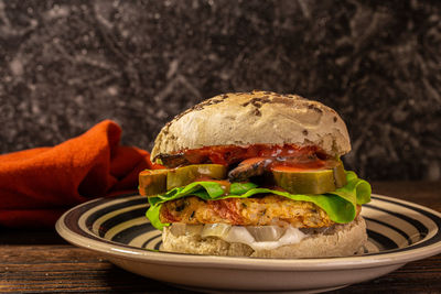 Close-up of burger in plate on table