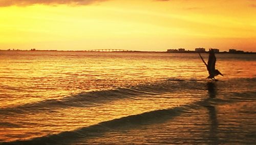 Scenic view of sea at sunset