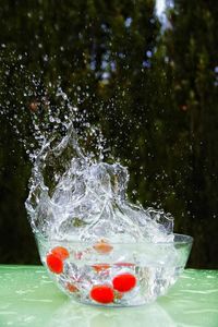 Close-up of water splashing on rock