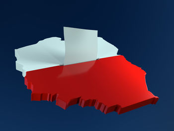 Low angle view of paper flag against blue sky