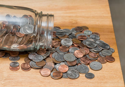 High angle view of coins on table