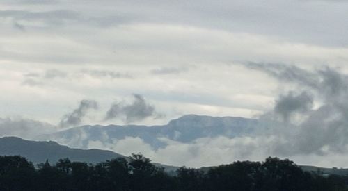 Low angle view of silhouette mountain against sky