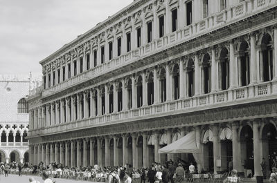 Group of people on building in city