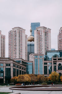 Modern buildings against clear sky in city