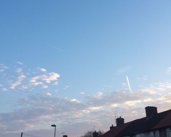 Low angle view of smoke against sky
