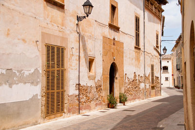 Alley amidst buildings in city