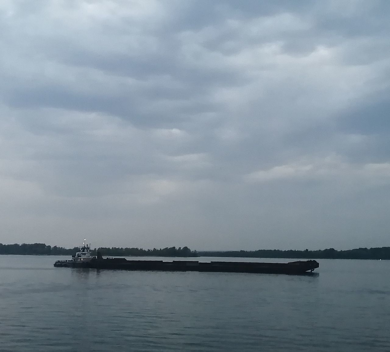 water, cloud, sky, sea, transportation, vehicle, nautical vessel, nature, no people, mode of transportation, beauty in nature, scenics - nature, day, architecture, bay, outdoors, horizon, tranquility, channel, tranquil scene, pier, travel, overcast, ship, travel destinations, boat, coast, built structure, environment
