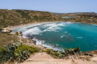 Scenic view of sea against clear blue sky