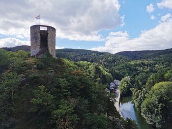 Castle on mountain against sky