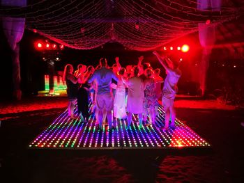 People at illuminated nightclub