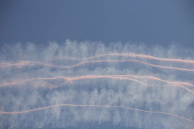 Low angle view of vapor trails in sky