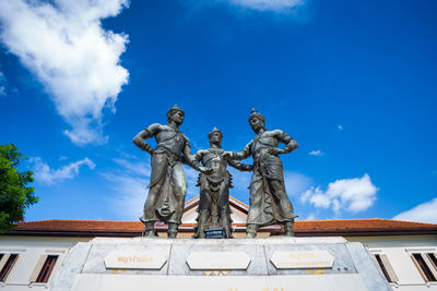 Low angle view of statue against sky