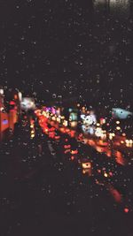 Traffic on road during rainy season at night