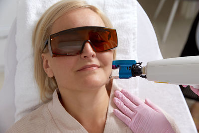 Close-up of woman wearing sunglasses