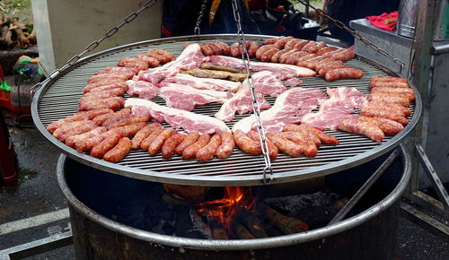 High angle view of meat on barbecue grill