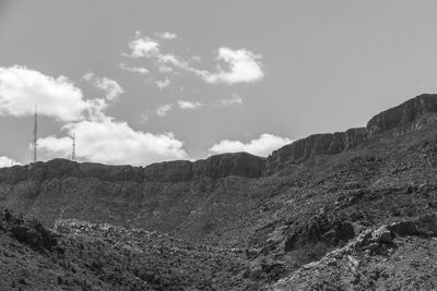 Low angle view of mountain range against sky