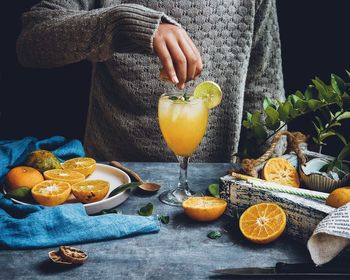 Directly above shot of man with fruits on table